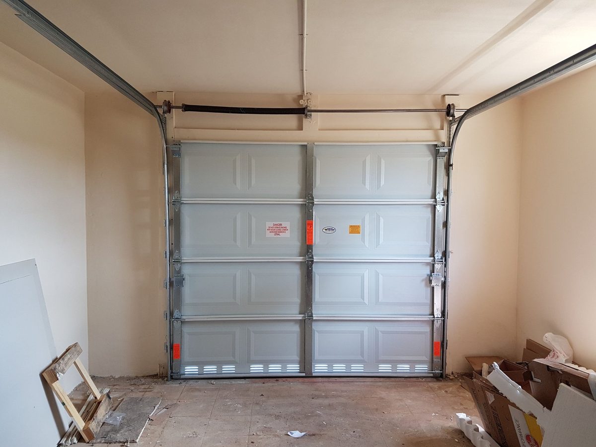 Clean new garage door installation interior garage view