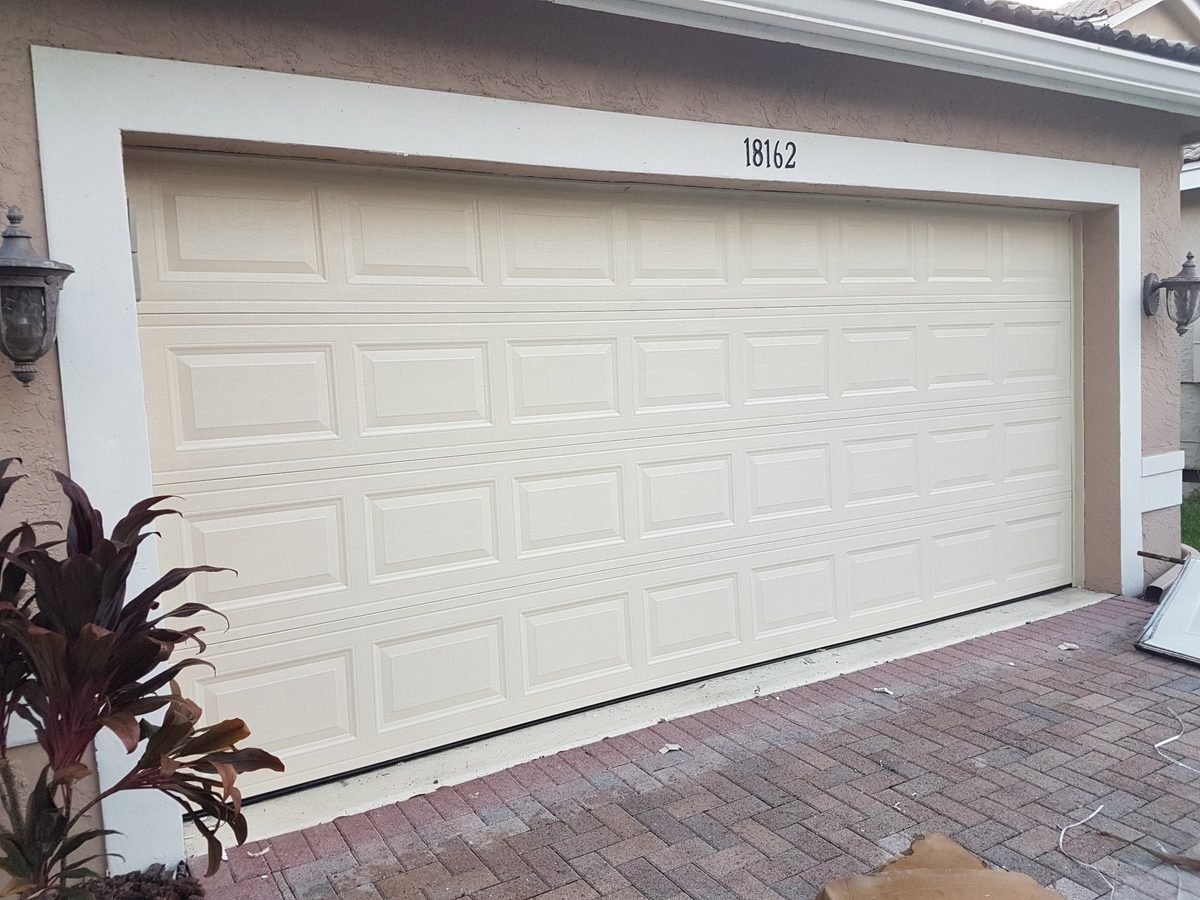 New garage door after professional installation by OM Garage Door Florida