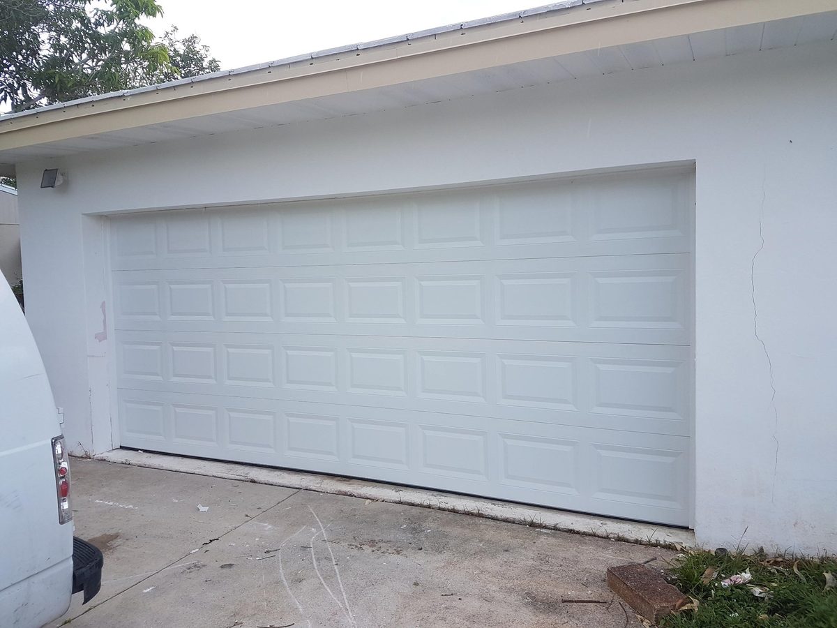 New white garage door installation in Broward County by OM Garage Door Florida