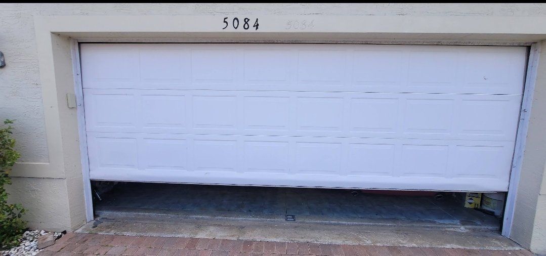 Garage door after professional panel repair by OM Garage Door Florida