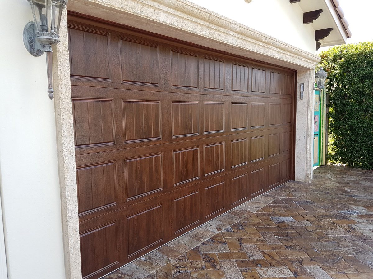 Wood-look garage door installation in Florida by OM Garage Door Florida